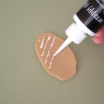 Tip-apply a bit of glue and then let dry before adding second coat of glue.