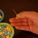 Thread cord onto needle