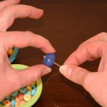 Pierce jelly bean with needle