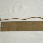 Measure three inches from third bead and make knot